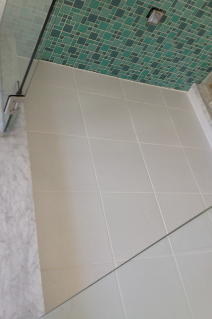 Multi Colored Glass Tiles With A White Ceramic Shower Floor