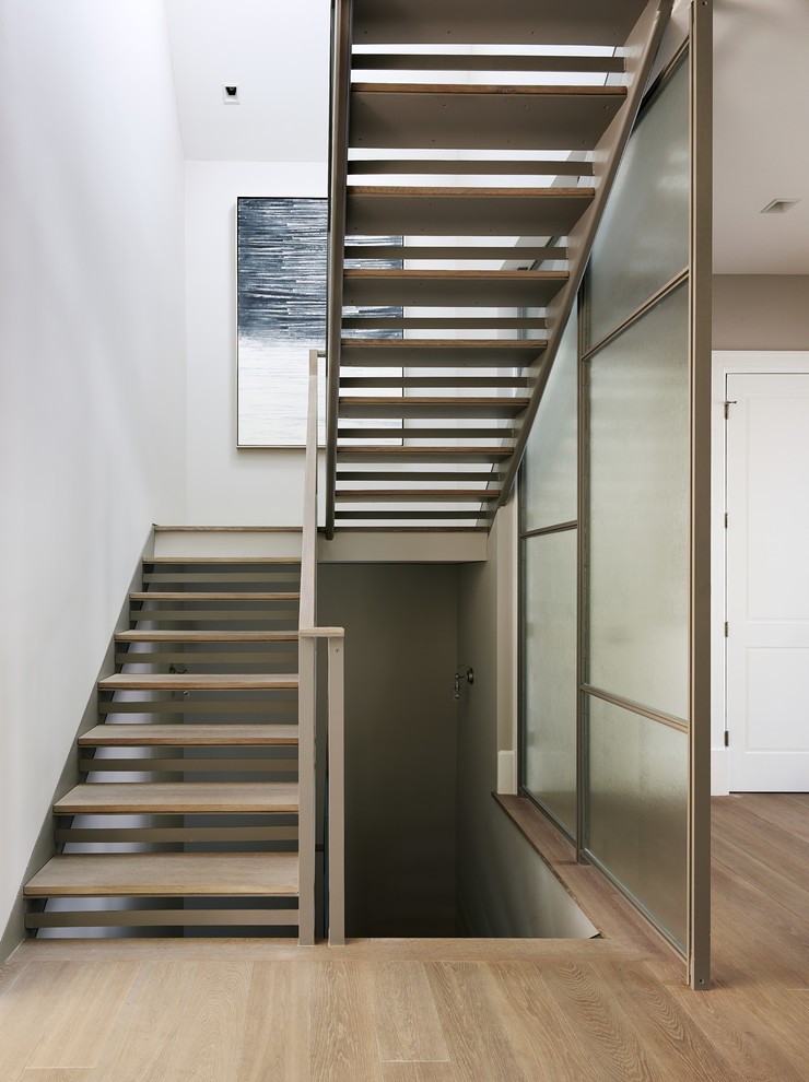 Contemporary wood u-shaped staircase in San Francisco with open risers.