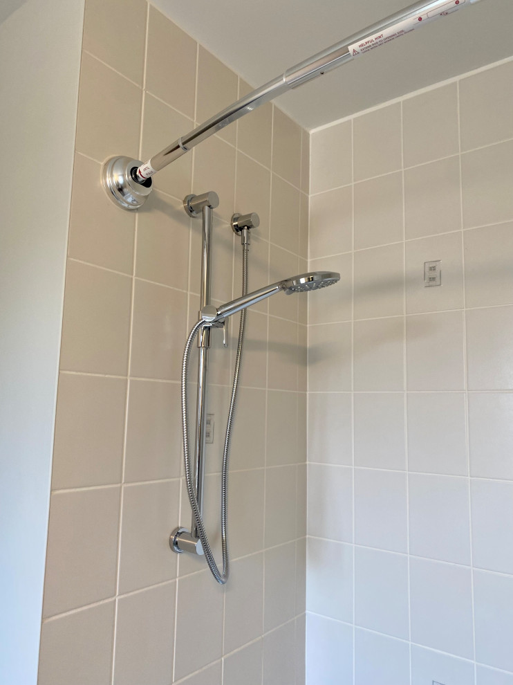 Inspiration for a transitional 3/4 porcelain tile, gray floor and single-sink bathroom remodel with recessed-panel cabinets, a one-piece toilet, gray walls, an undermount sink, quartzite countertops, white countertops and a built-in vanity