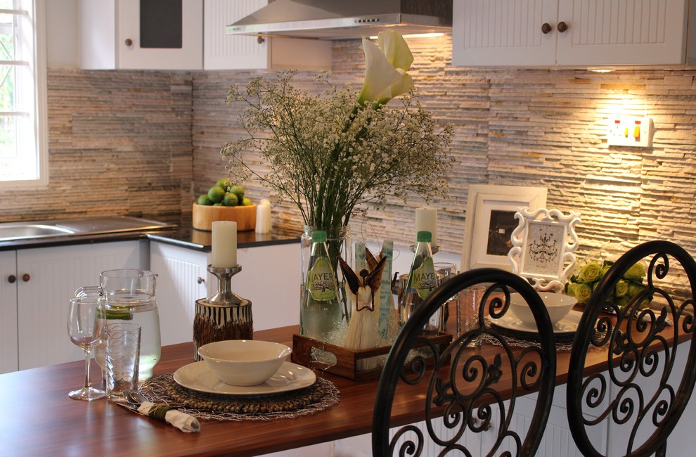 Kitchen - rustic kitchen idea with beaded inset cabinets, white cabinets, granite countertops and stone tile backsplash