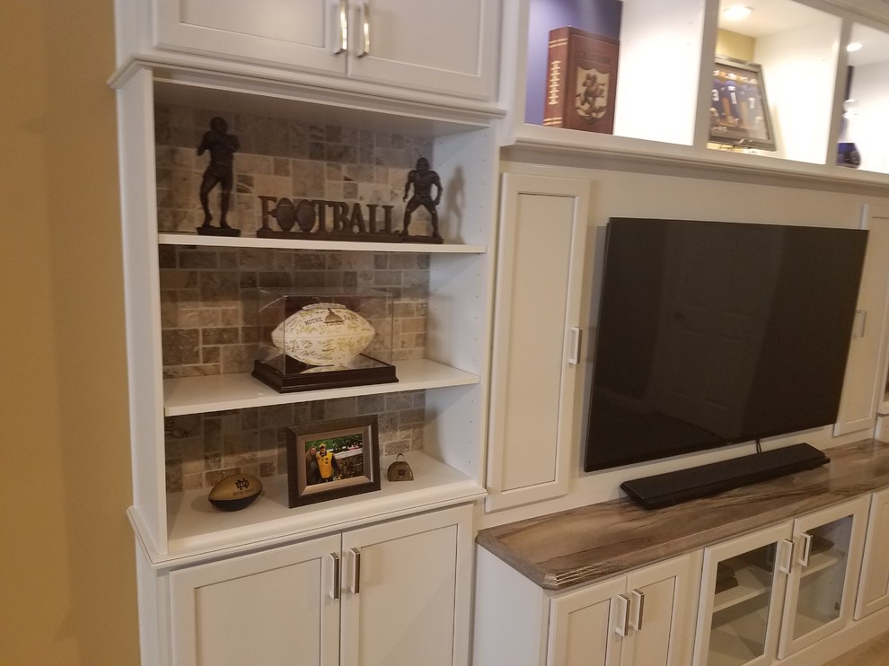 Inspiration for a mid-sized transitional underground carpeted and beige floor basement remodel with brown walls and no fireplace