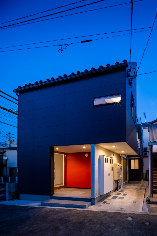Example of a small minimalist black three-story mixed siding exterior home design in Tokyo with a metal roof and a black roof
