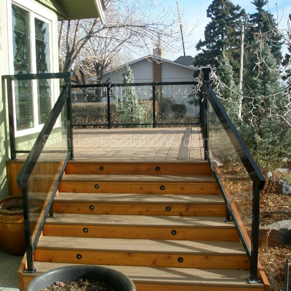 Inspiration for a transitional backyard deck in Calgary with no cover.