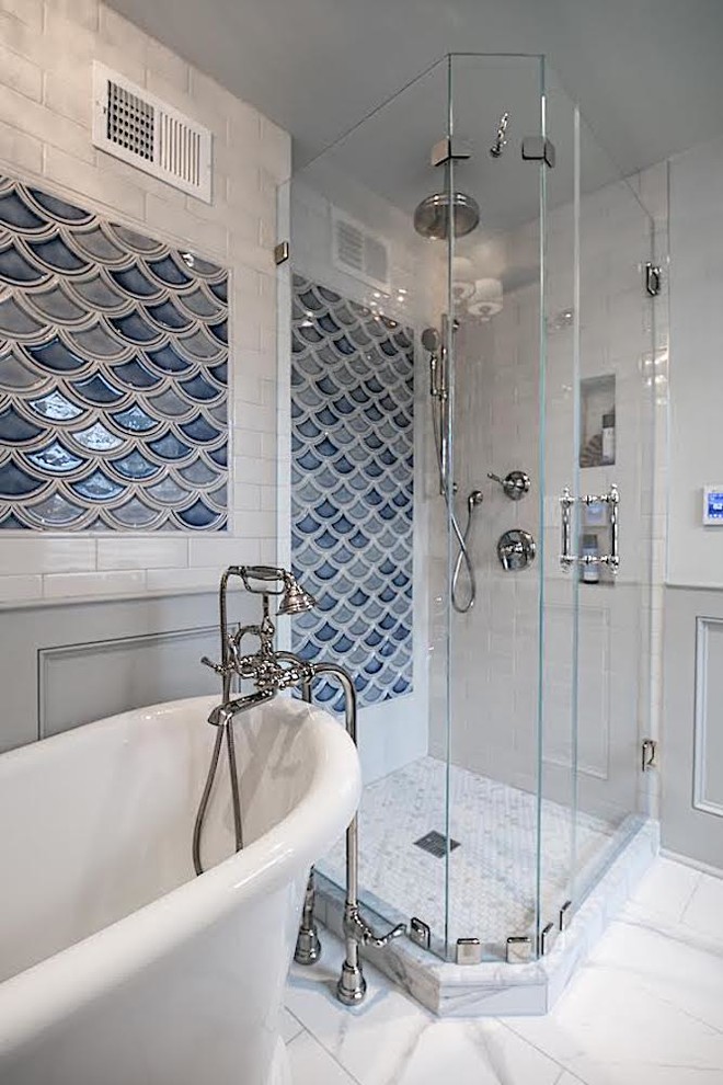 Inspiration for a mid-sized transitional master bathroom in Philadelphia with beaded inset cabinets, white cabinets, a freestanding tub, a corner shower, blue tile, gray tile, beige walls, marble floors, an undermount sink, marble benchtops, white floor, a hinged shower door, white benchtops, a wall-mount toilet and ceramic tile.