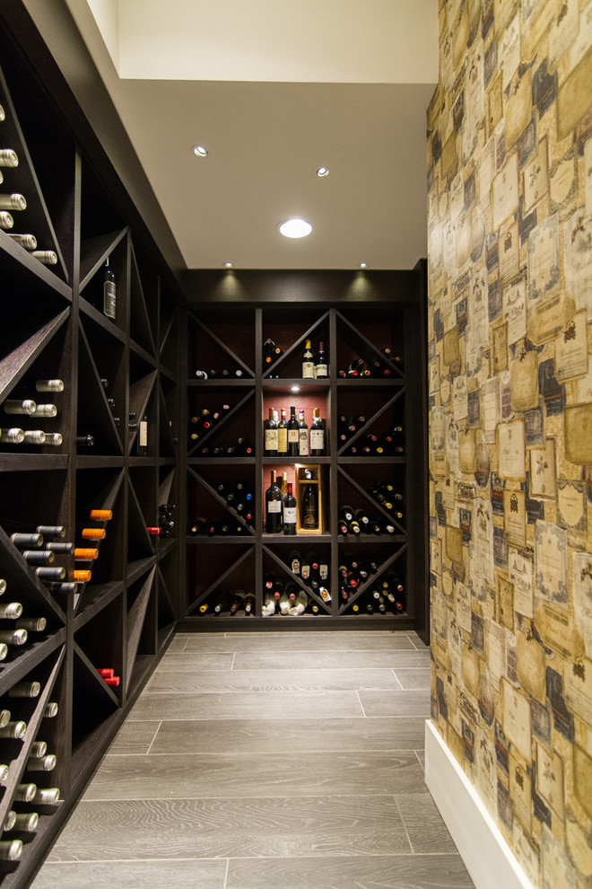 This is an example of an eclectic wine cellar in Vancouver.