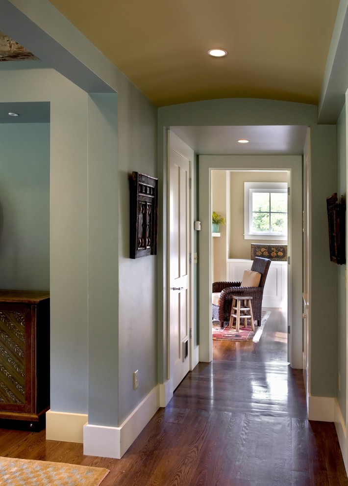 Inspiration for a country hallway in Burlington with blue walls and dark hardwood floors.