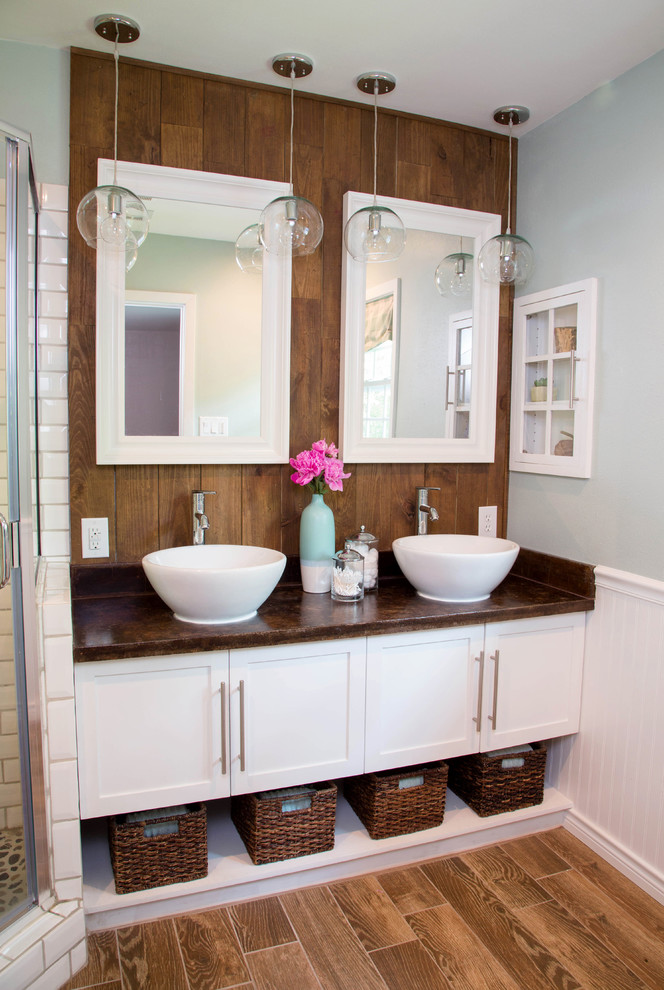 This is an example of a mid-sized traditional master bathroom in Little Rock with a vessel sink, shaker cabinets, white cabinets, white tile, subway tile, porcelain floors and green walls.