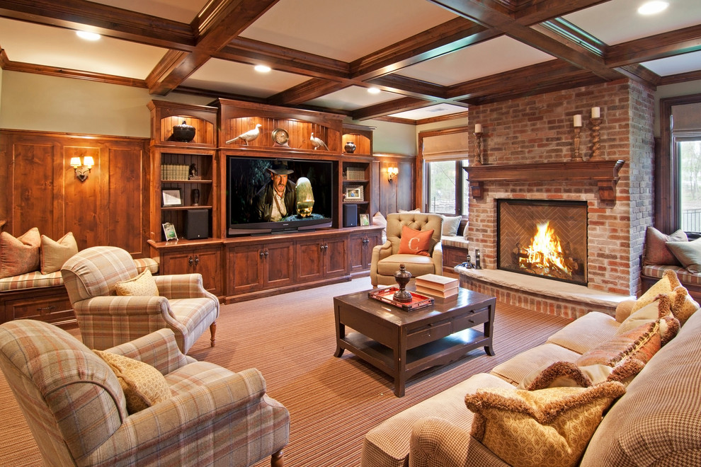 This is an example of a traditional family room in Minneapolis with carpet, a standard fireplace, a brick fireplace surround and a built-in media wall.
