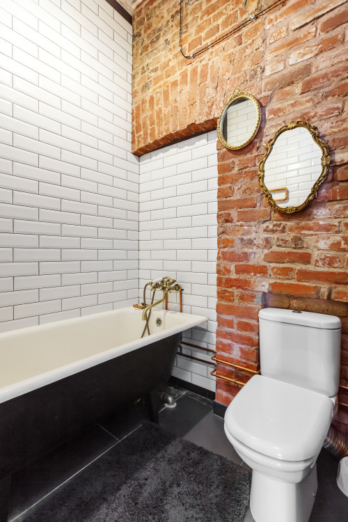 Exposed Brick Walls with White Subway Tiles and Gray Floor Tiles