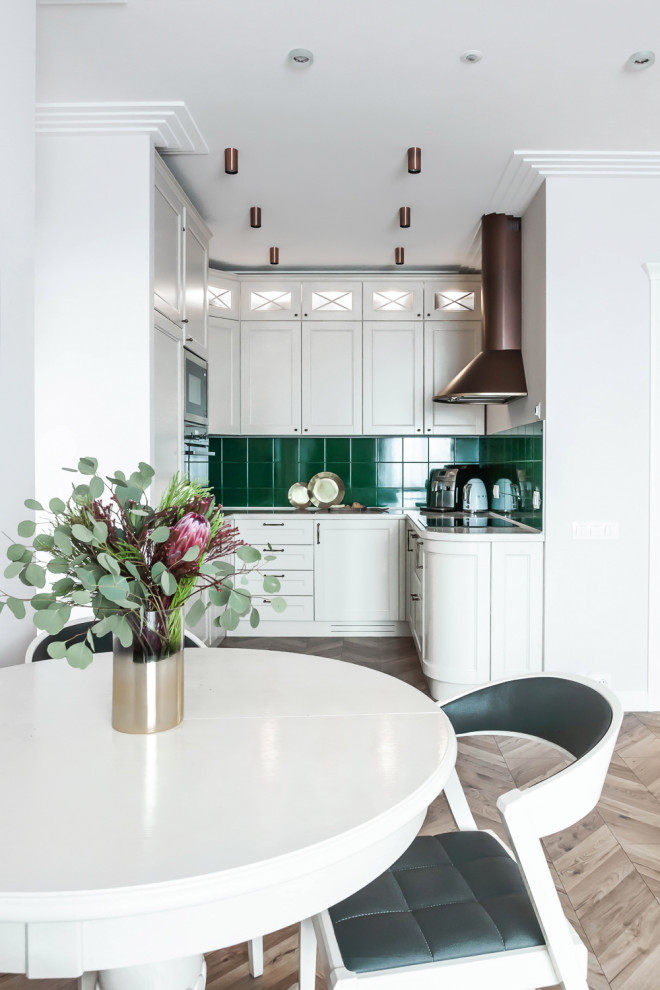 Inspiration for a small contemporary u-shaped eat-in kitchen in Moscow with white cabinets, quartz benchtops, green splashback, laminate floors, beige floor, shaker cabinets, panelled appliances, no island and white benchtop.