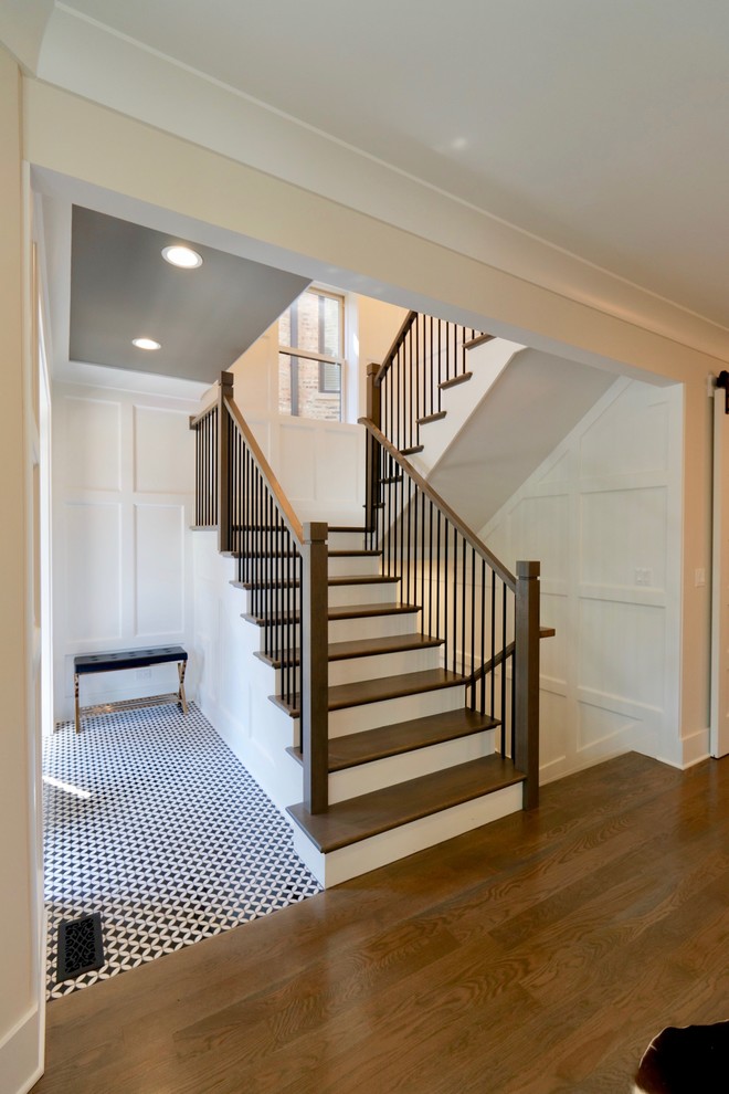 Design ideas for a mid-sized transitional wood u-shaped staircase in Chicago with wood risers and mixed railing.