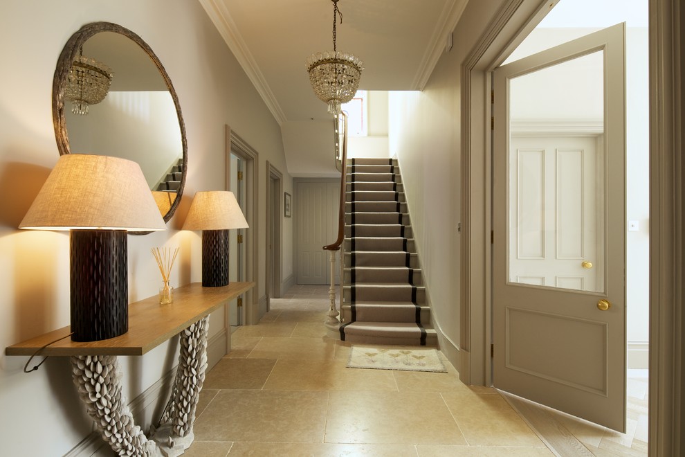 Design ideas for a transitional hallway in London with grey walls and beige floor.