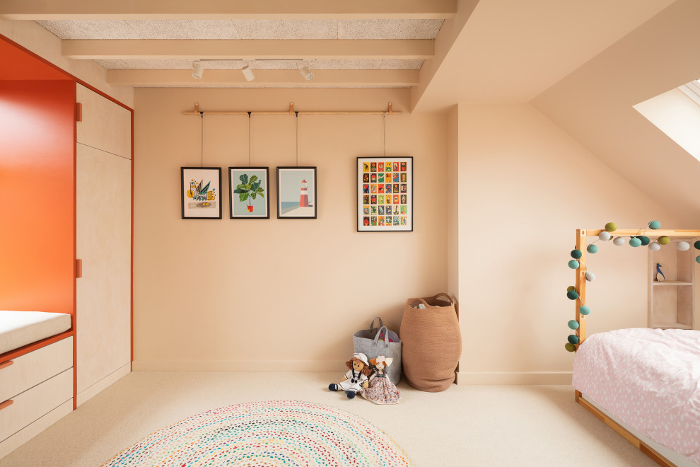 Photo of a small scandi kids' bedroom in London with grey walls, carpet, beige floors and exposed beams.