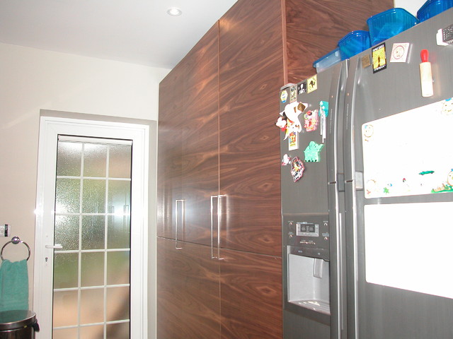 Handle-less kitchen, book-matched Walnut contemporary-kitchen