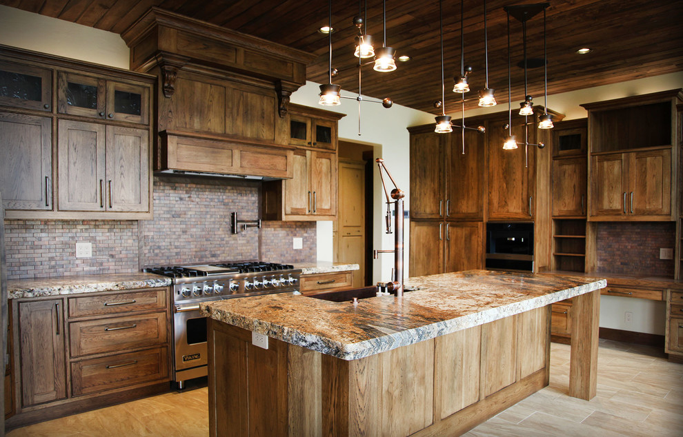 Kitchen - large rustic l-shaped light wood floor and beige floor kitchen idea with medium tone wood cabinets, stainless steel appliances, a farmhouse sink, shaker cabinets, granite countertops, brown backsplash and an island