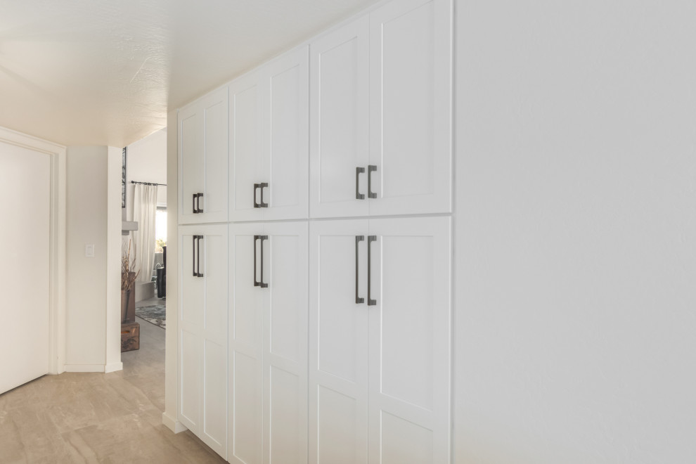 Example of a transitional gray floor kitchen design in Phoenix with a farmhouse sink, shaker cabinets, white cabinets and subway tile backsplash