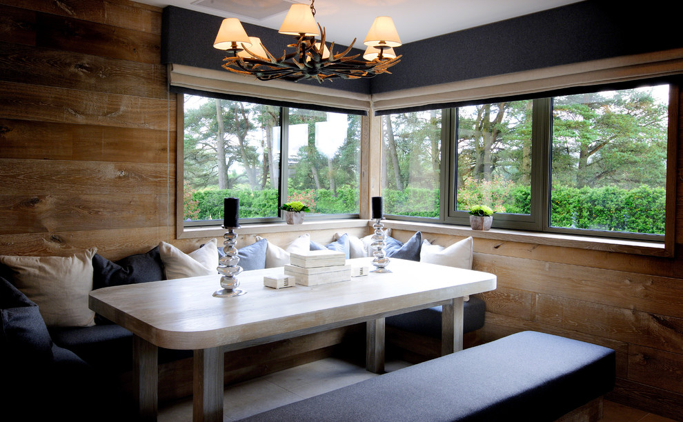 Small contemporary kitchen/dining combo in Cheshire with brown walls, limestone floors and no fireplace.