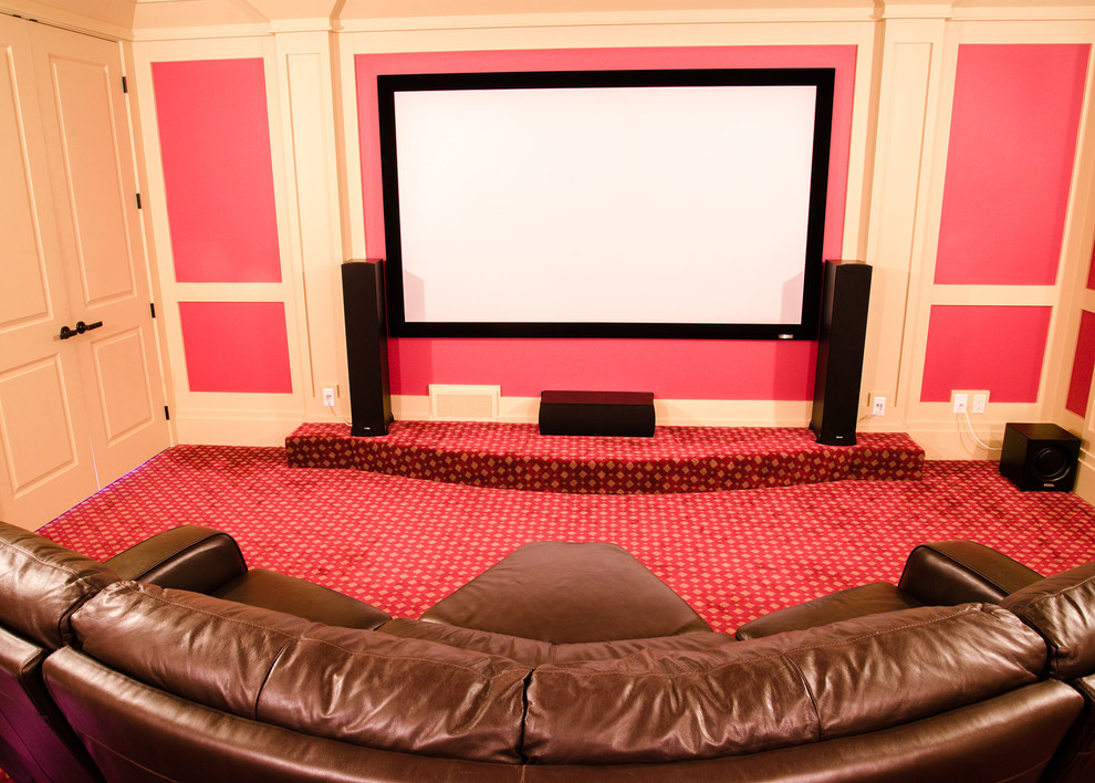 Design ideas for a mid-sized traditional enclosed home theatre in Other with red walls, carpet, a built-in media wall and red floor.