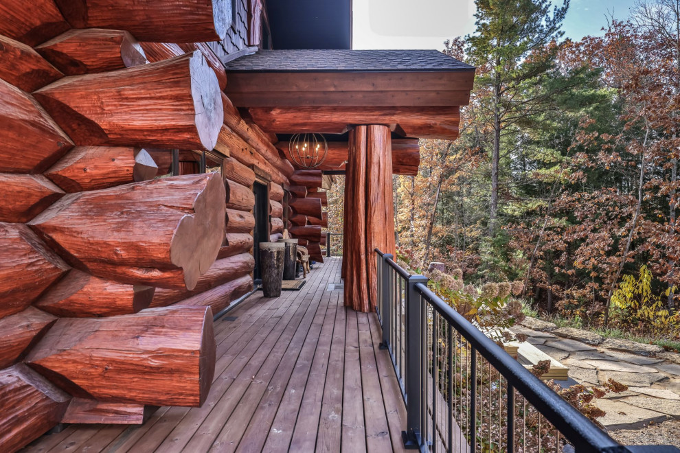 Example of a huge mountain style ground level metal railing deck design