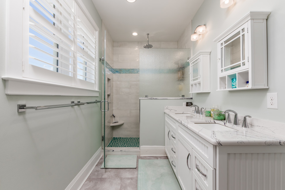 Inspiration for a small coastal master white tile and porcelain tile ceramic tile, gray floor and double-sink bathroom remodel in Other with beaded inset cabinets, white cabinets, gray walls, an undermount sink, marble countertops, a hinged shower door, white countertops and a built-in vanity