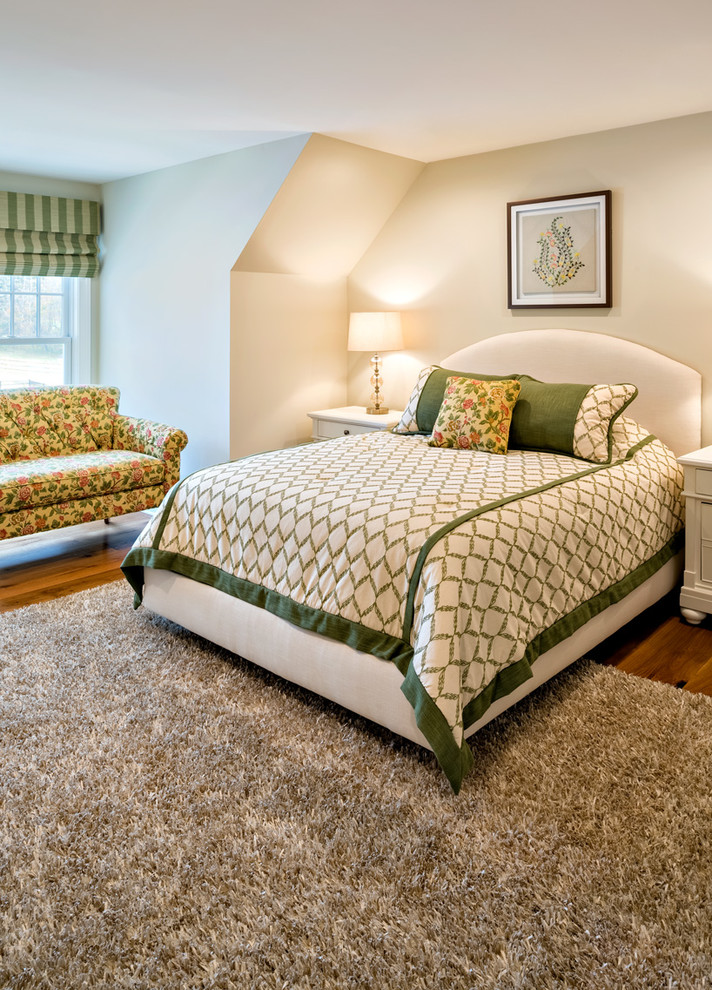 Country bedroom in Philadelphia with beige walls and dark hardwood floors.