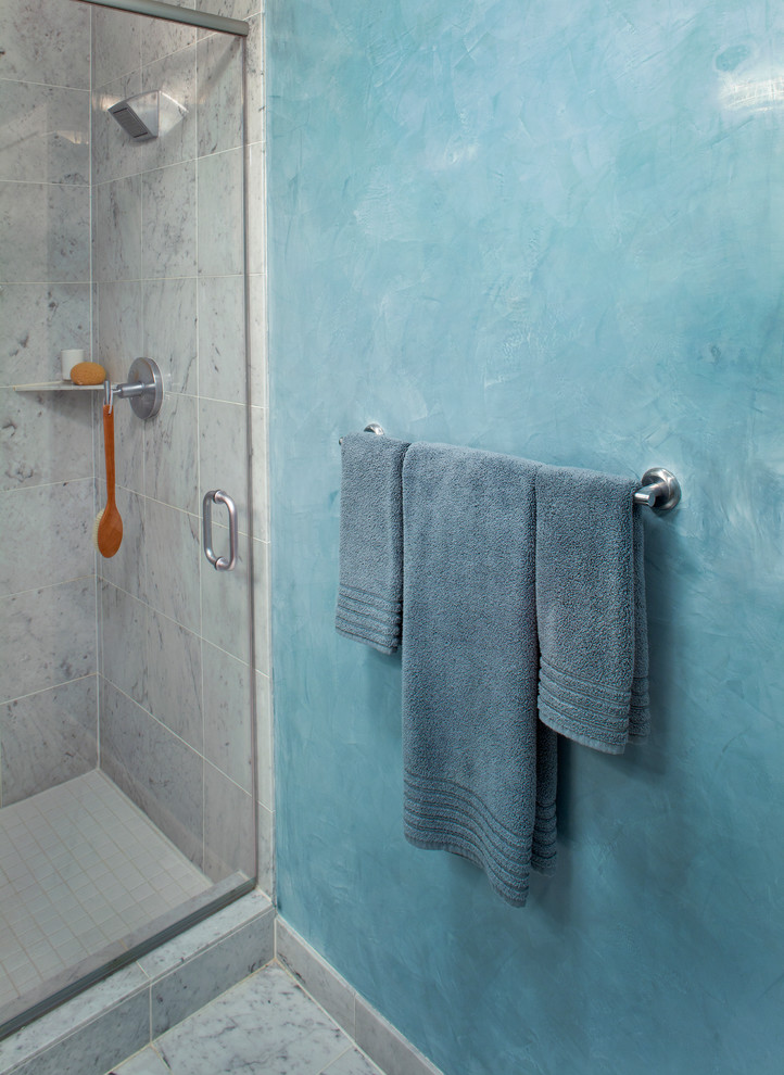 Design ideas for a small contemporary 3/4 bathroom in New York with an alcove shower, blue walls and porcelain floors.