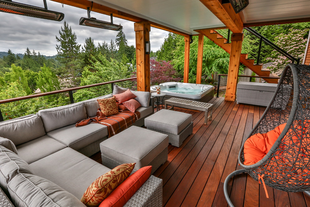 Design ideas for a large modern backyard deck in Seattle with no cover.
