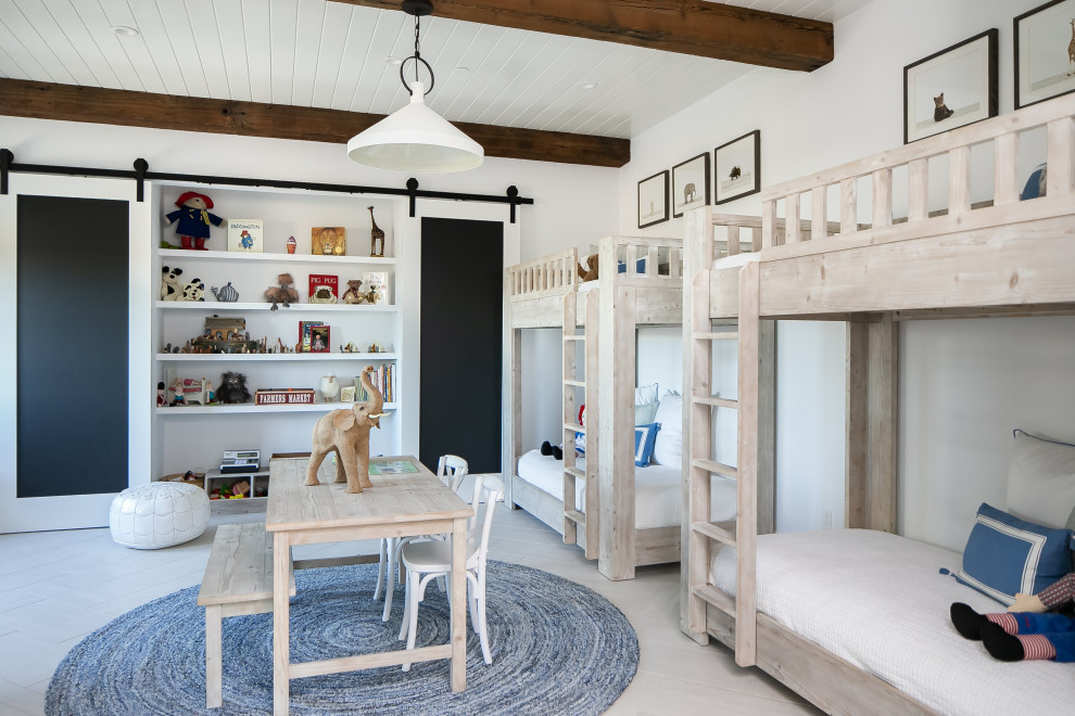 Vineyard Estate - Example of a bedroom cottage gender-neutral light wood floor, beige floor, exposed beam and shiplap ceiling kids' bedroom design in Orange County with white walls