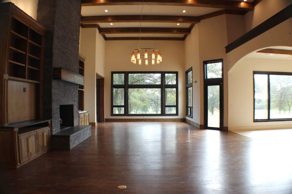 Inspiration for an expansive transitional formal open concept living room in Dallas with beige walls, a two-sided fireplace, brown floor, medium hardwood floors, a stone fireplace surround and no tv.