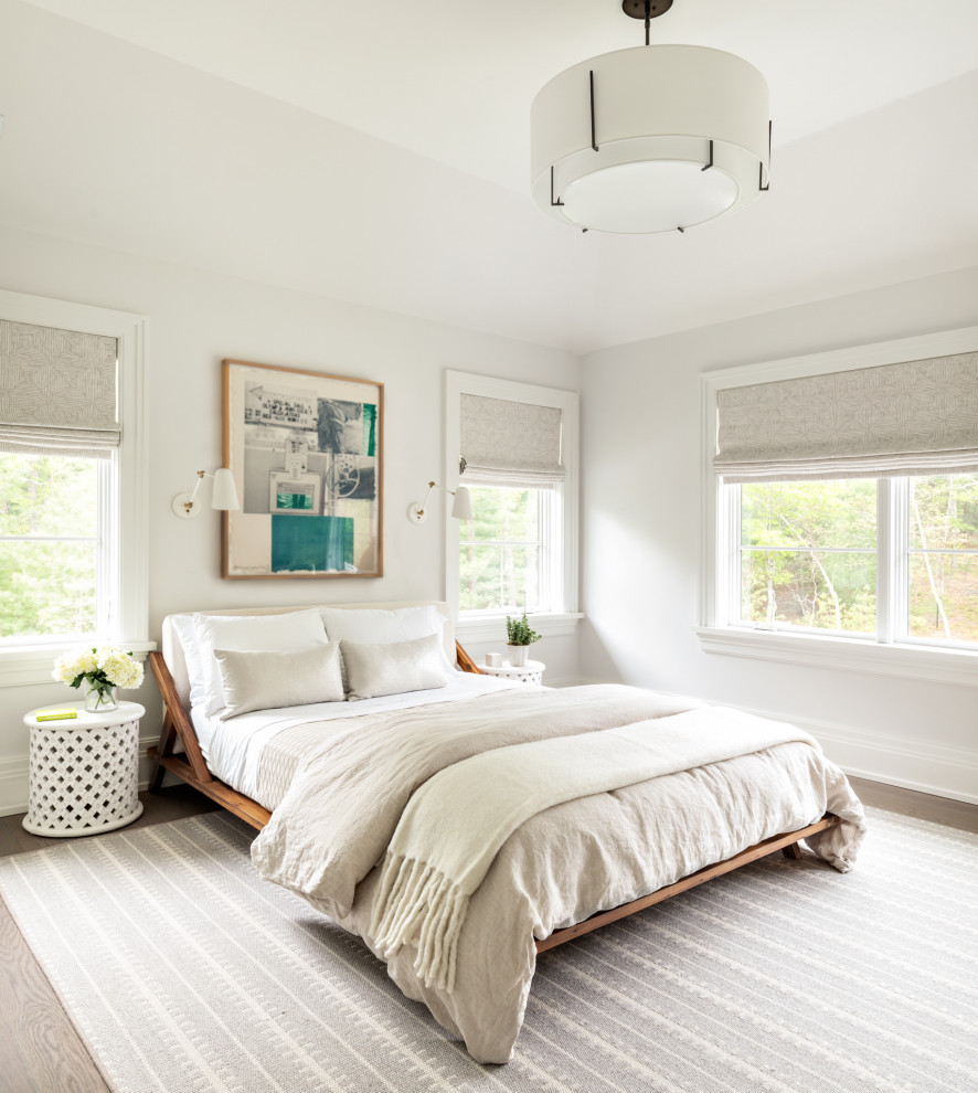 This is an example of a mid-sized transitional master bedroom in New York with grey walls and beige floor.