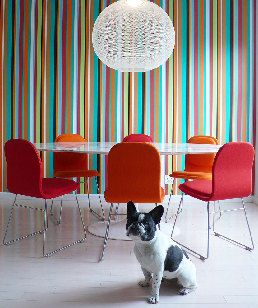 Photo of a contemporary dining room in New York with multi-coloured walls, painted wood floors, no fireplace and white floor.