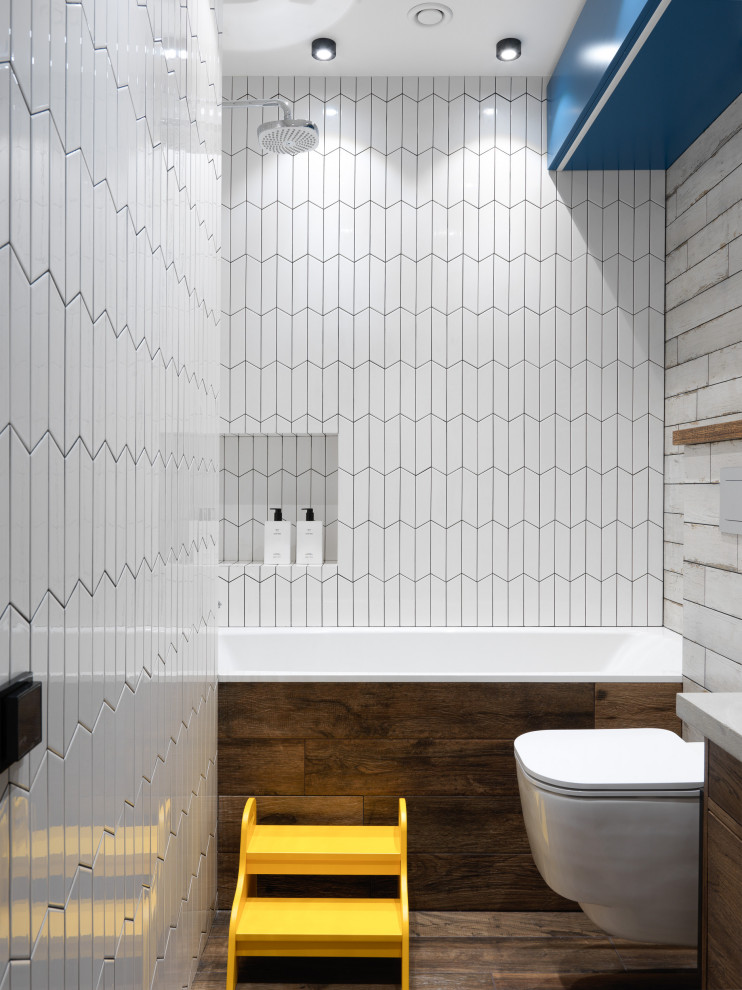Design ideas for a mid-sized industrial kids bathroom in Moscow with flat-panel cabinets, brown cabinets, an undermount tub, a wall-mount toilet, white tile, ceramic tile, white walls, porcelain floors, a drop-in sink, concrete benchtops, brown floor, grey benchtops, an enclosed toilet, a single vanity and a freestanding vanity.