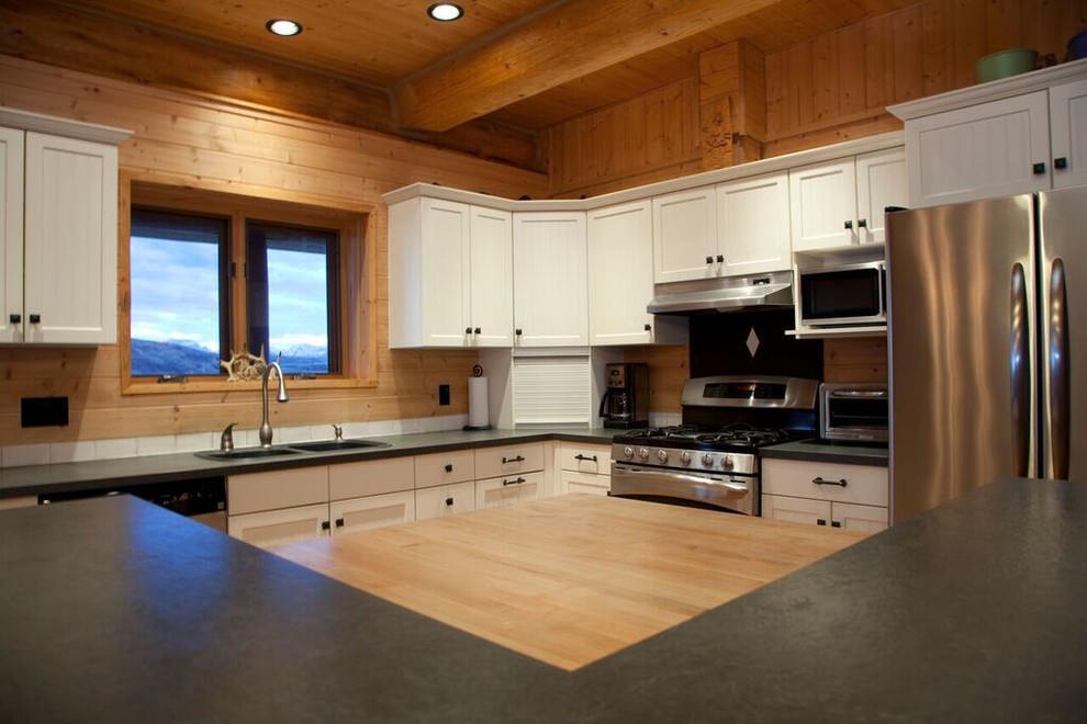 Inspiration for a mid-sized rustic l-shaped medium tone wood floor kitchen remodel with shaker cabinets, stainless steel appliances and an island
