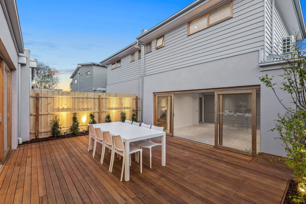 Design ideas for a small contemporary backyard deck in Melbourne with no cover.