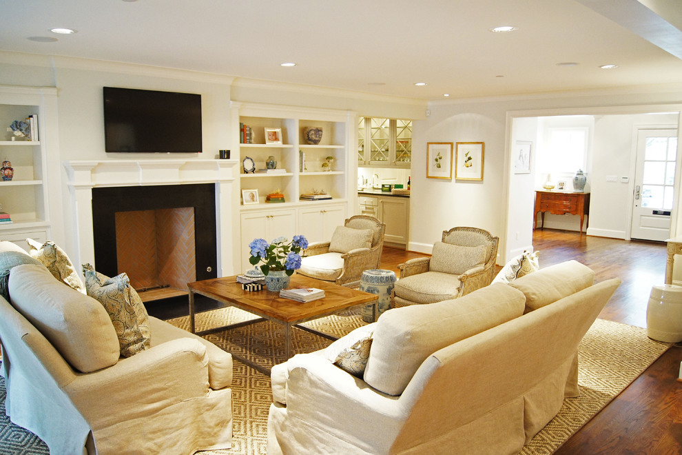 Photo of a large traditional living room in Dallas with a wall-mounted tv.