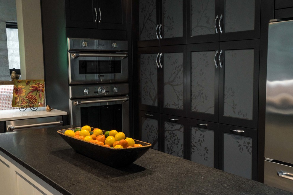 Inspiration for a mid-sized transitional kitchen remodel in Austin with flat-panel cabinets