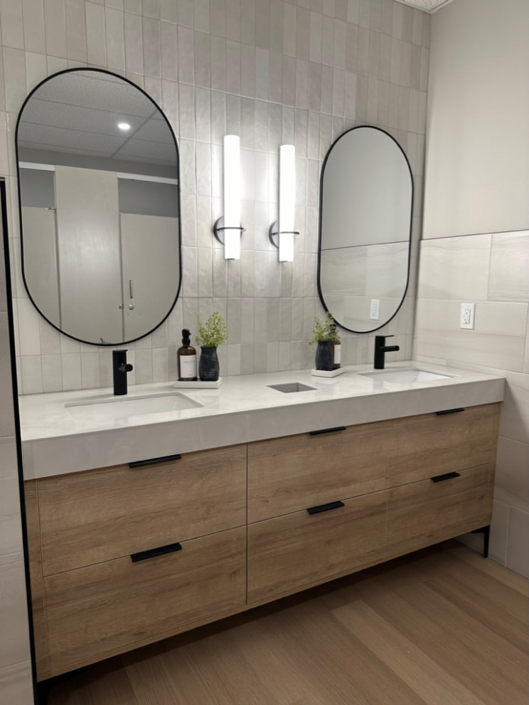 Commercial bathroom with custom white oak vanities and tile work took these bathrooms to the next level.