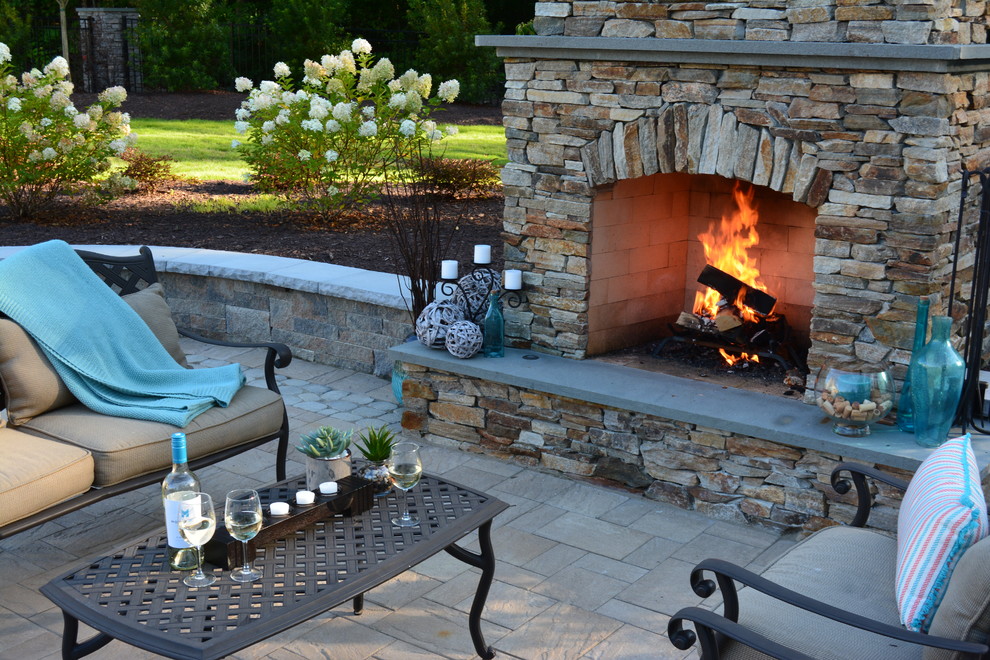 Photo of a large arts and crafts backyard patio in Richmond with a fire feature, concrete pavers and no cover.