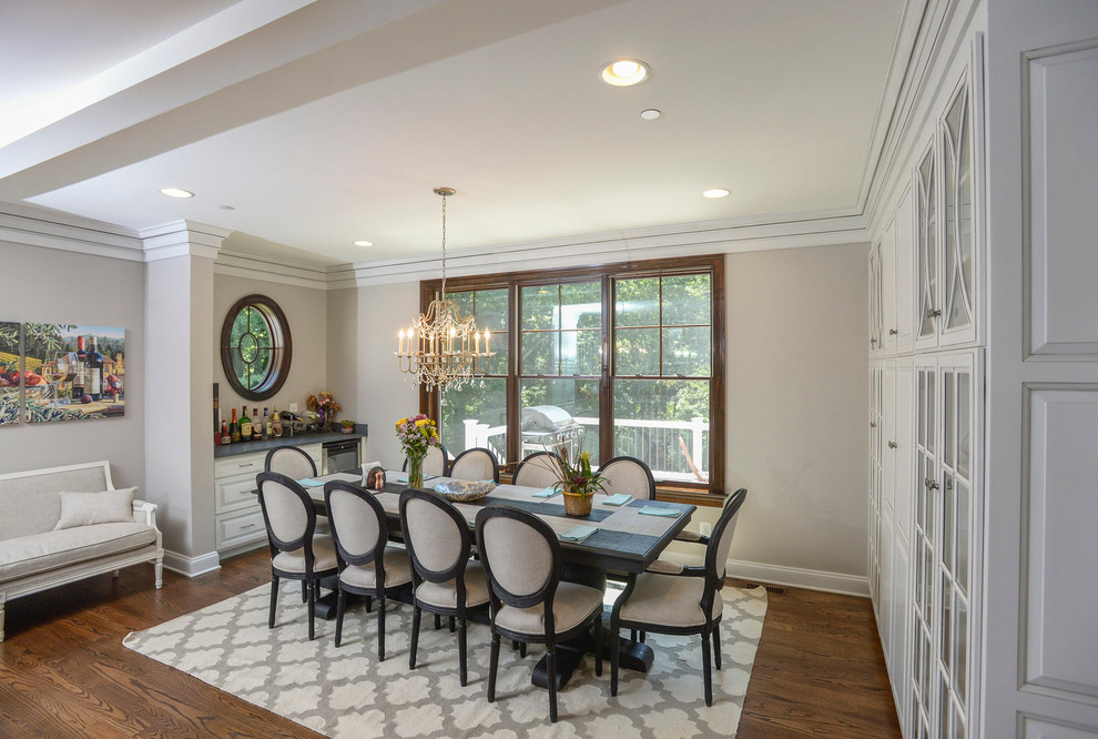 Photo of a traditional dining room in Baltimore with grey walls and dark hardwood floors.