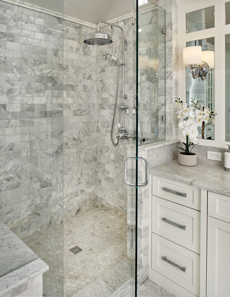 Inspiration for a large traditional master bathroom in Dallas with recessed-panel cabinets, white cabinets, an undermount tub, an alcove shower, marble floors and marble benchtops.