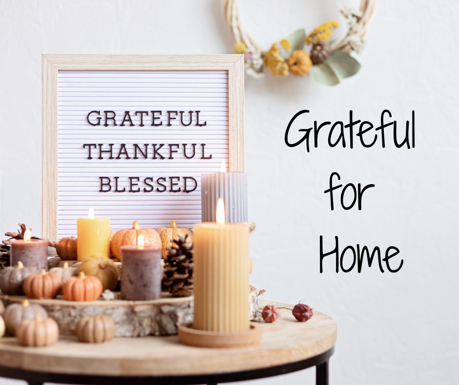 Warm, inviting living room decorated for fall with natural light, cozy textures, and neutral tones representing gratitude, comfort, and the feeling of home. Warren-Lee Construction celebrates qualit