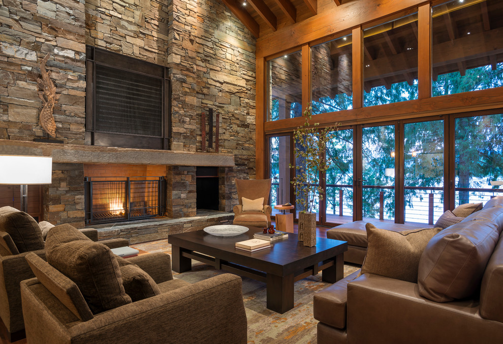 Design ideas for a country living room in Seattle with a standard fireplace and a stone fireplace surround.