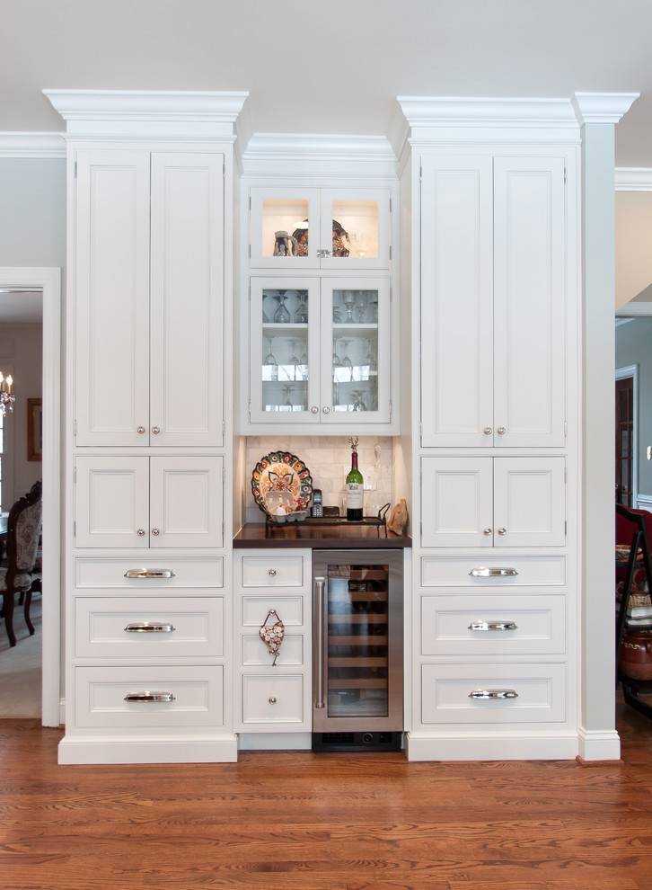 Kitchen - large transitional kitchen idea in DC Metro with beaded inset cabinets, white cabinets, marble countertops, white backsplash, subway tile backsplash, stainless steel appliances and an island
