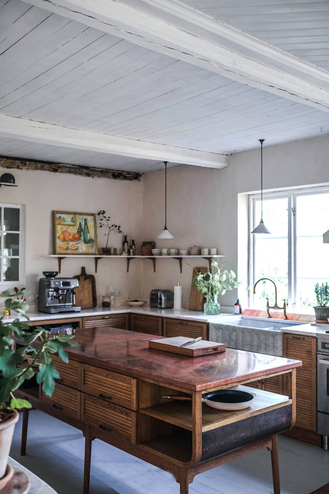 Large midcentury u-shaped eat-in kitchen in Other with a double-bowl sink, medium wood cabinets, marble benchtops, pink splashback, marble splashback, stainless steel appliances, painted wood floors, multiple islands, white floor, pink benchtop and wood.