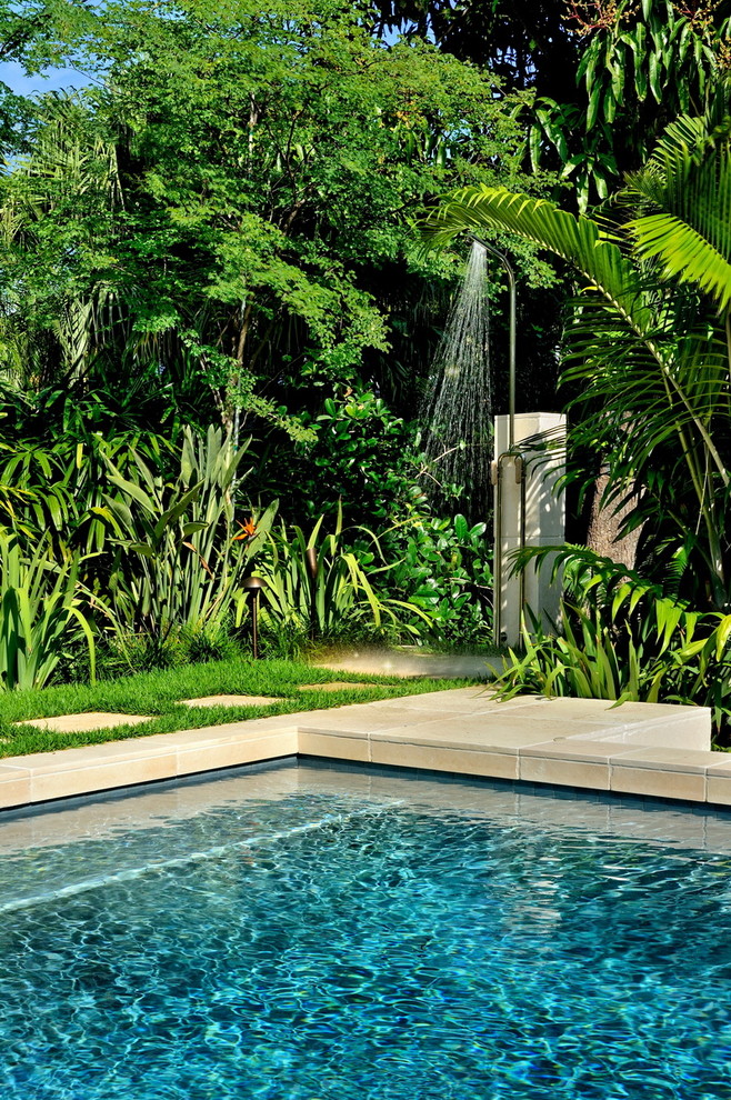 Inspiration for a tropical backyard patio in Miami with an outdoor shower.