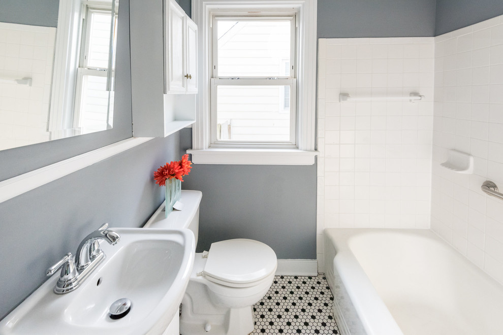 Design ideas for a small contemporary 3/4 bathroom in Wilmington with a shower/bathtub combo, raised-panel cabinets, white cabinets, a two-piece toilet, grey walls, mosaic tile floors and a console sink.