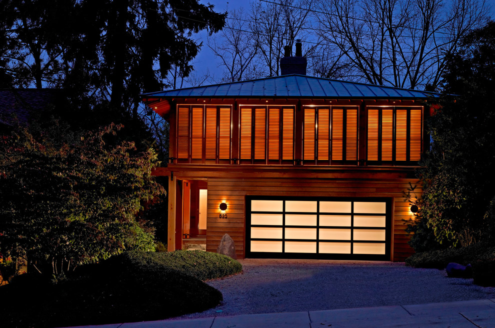 Inspiration for a contemporary exterior in Detroit with wood siding and a hip roof.