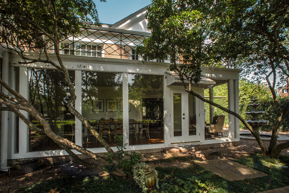 Mid-sized traditional sunroom in Houston with medium hardwood floors and a standard ceiling.