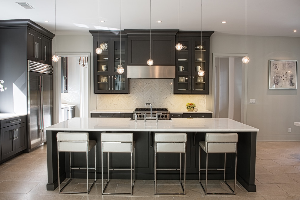 Mid-sized transitional l-shaped kitchen in Other with a farmhouse sink, shaker cabinets, black cabinets, white splashback, stone tile splashback, stainless steel appliances, porcelain floors and with island.