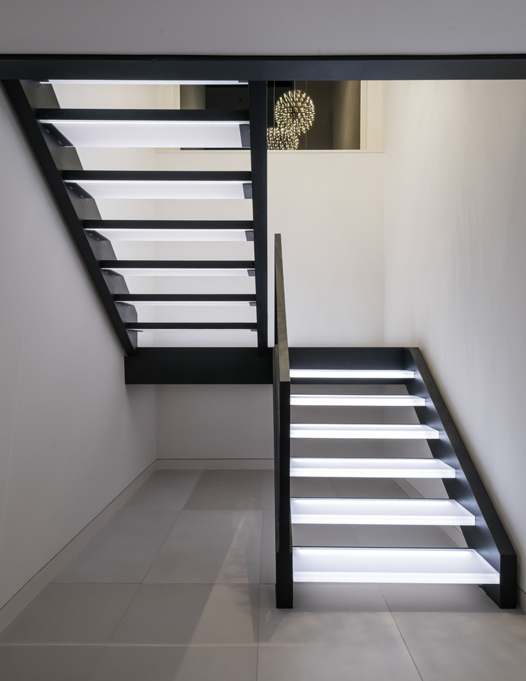 Photo of a contemporary u-shaped staircase in Other with open risers.